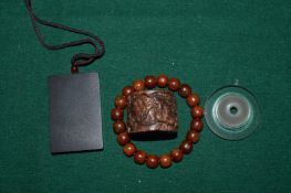 A Japanese archers ring and other items.