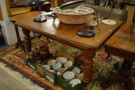A Victorian walnut extending table with one leaf.
