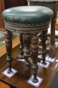 A Victorian walnut revolving music seat.