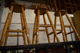 A set of three ash stools.