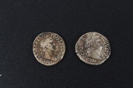 Two silver Roman style coins.