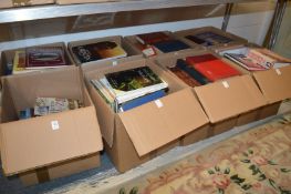 Eight boxes of assorted books.