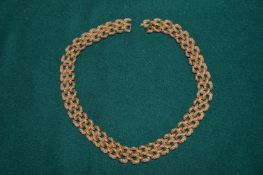 A Monet gilt metal necklace.