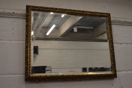 A rectangular gilt framed mirror.