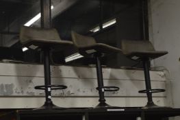 Three bar stools.