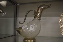 A duck shaped claret jug.