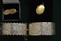 Two silver bracelets, pair of cufflinks and a locket.