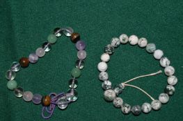 Two bead bracelets.