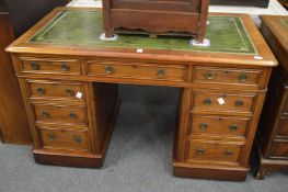 A Victorian walnut pedestal desk.