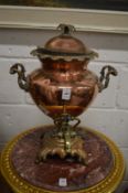 A copper and brass samovar.