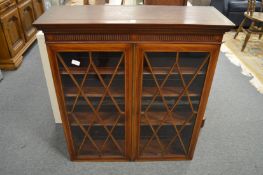 An inlaid mahogany two door bookcase top.