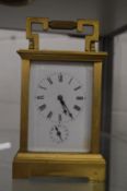 A brass carriage clock.