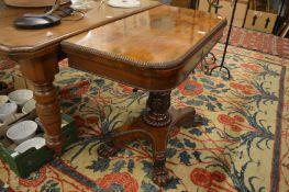 A 19th century rosewood D shaped fold-over card table.