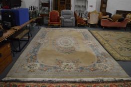 A large Chinese yellow ground carpet with floral decoration, 500cm x 280cm.