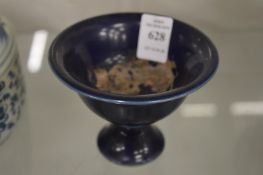A Chinese dark blue glazed stem cup.