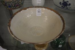 Chinese porcelain circular bowl with incised decoration.