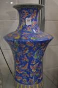 A large Chinese vase decorated with butterflies.