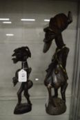 Two carved wood African figures.