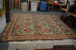 An Arts and Crafts style carpet, beige ground with stylised floral decoration, 332cm x 290cm.