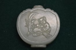 A Chinese jadeite snuff bottle.