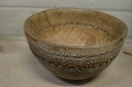 An unusual studded wooden bowl.