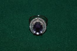 A silver and natural amethyst ring with certificate.