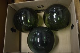 Three green glass fishing floats.