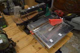 An electric tile cutting tabletop saw and a fret saw.
