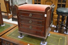An Edwardian mahogany three drawer music seat.