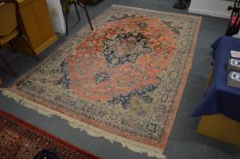 A Persian style carpet, pink ground with stylised decoration, 278cm x 182cm.