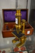 A good brass microscope with original mahogany box and accessories.
