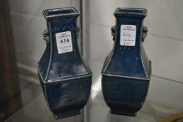 A pair of Chinese blue glazed square shaped vases.