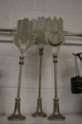 Three decorative Eastern metal hands-on stands.