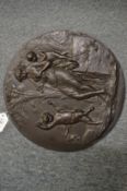A good relief cast bronze circular plaque depicting classical figures in a landscape.