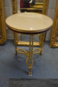 A good ormolu and marble top circular gueridon with three pairs of column supports terminating