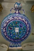 An Iznik style moon flask.