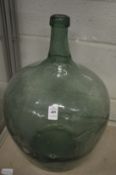 A glass carboy.