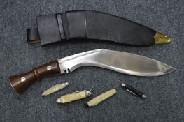 A Gurkha kukri and penknives.
