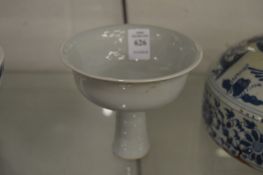 A pale celadon glazed stem cup.