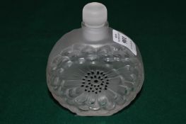 A Lalique frosted glass flower head form scent bottle and stopper.