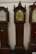 An 18th century oak longcase clock with eight day movement, the arch shaped brass dial signed