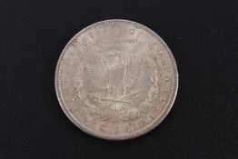 A silver one dollar coin, 1900.
