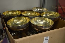 A set of six goblets with figural stems.