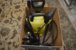 A Karcher pressure washer with accessories.