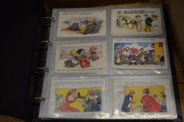 An album containing a good collection of saucy postcards.