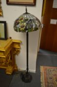 Tiffany style floor standing lamp with butterfly shade.
