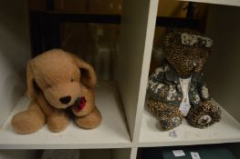 A puppy dog toy and a teddy bear door stop.