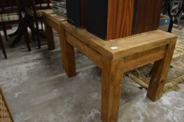 A pair of hardwood occasional tables.