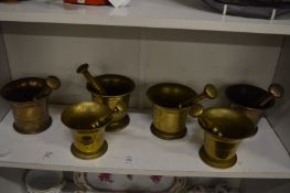A group of six bronze pestle and mortars.