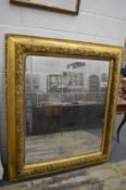 A good large 19th century gilt framed rectangular mirror with leaf and berry decorated frame,